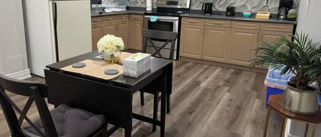 Fridge, microwave, stovetop, coffee/tea maker