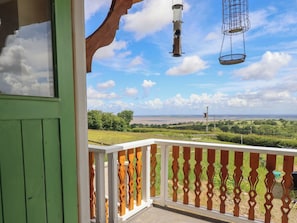 A balcony with a view of a green landscape and a clear sky. - Hay Loft at Ebenezer Chapel (Holywell)