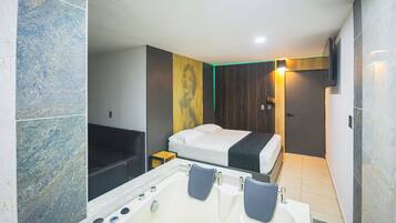 Deluxe Suite, Balcony, City View | Minibar, free WiFi, bed sheets