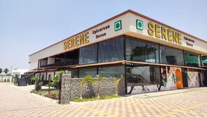A modern building with the name 'SERENE' prominently displayed. - Serene-Restaurant Rooms and Banquet (Indore)