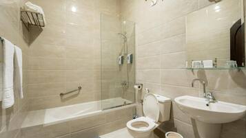 Combined shower/tub, free toiletries, hair dryer, slippers
