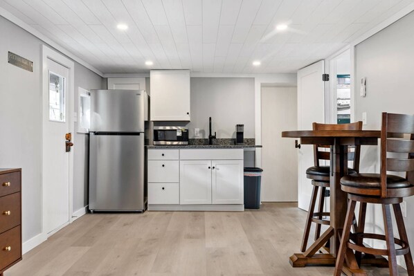 Fridge, microwave, stovetop, coffee/tea maker