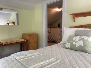 A bedroom with a bed, a bedside table, a mirror, a wardrobe, and a ceiling fan. -  3-bedroom country home in  Greenfield Ctr. NY. Central HVAC 15min to Saratoga. (Greenfield Center)