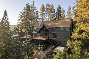 A modern two-story house with a deck, surrounded by dense forest. - Two Birds - expansive lake views and walk to lake (Lake Arrowhead)