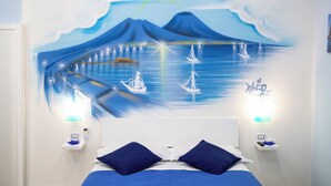 A bedroom with a bed, two nightstands, a wall mural, and a night light. - Holiday Home "Solemare Musica & Poesia" (napoli)