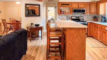 Coffee/tea maker, fridge, microwave, oven