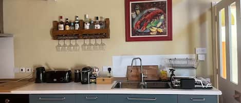 Coffee/tea maker, fridge, microwave, oven