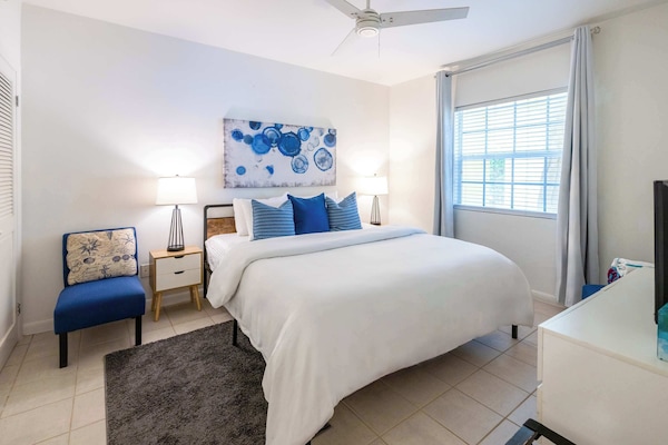 Your peaceful retreat features soft linens and coastal-inspired decor.