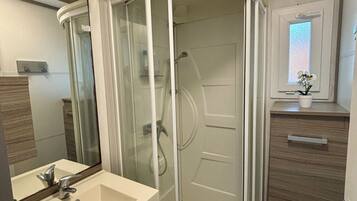 Shower, towels, toilet paper