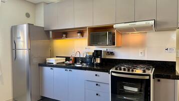 Fridge, microwave, oven, cookware/dishes/utensils