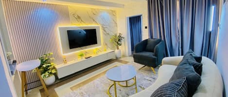 Apartamento Deluxe | Zona de estar