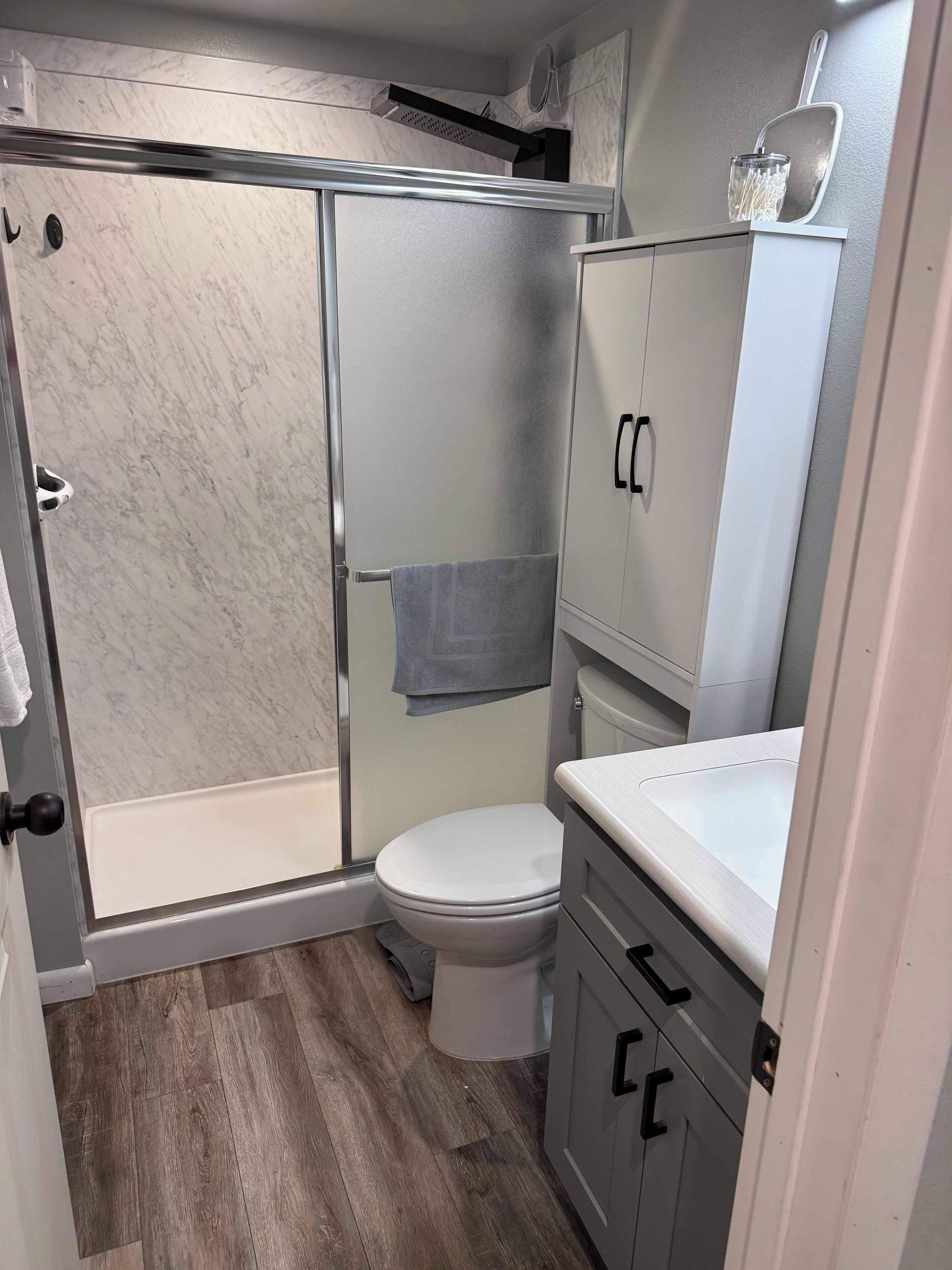 Shower, towels, toilet paper