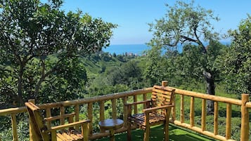 Bungalow Deluks, teras, pemandangan laut | Teras/patio