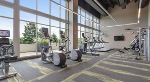 A gym with treadmills, elliptical machines, and weight equipment. - Relax, Recharge, Explore. Where Luxury Meets Comfort l The Perfect Atlanta Stay (Atlanta)