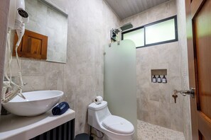 A bathroom with a sink, toilet, and shower area. - River Collection - Villa Essence #4 cabin in beautiful La Fortuna (La Fortuna)