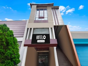 A hotel sign with 'HOTEL' and 'Company-Serviced' text. - Deluxe Prayagraj Central Shantila Inn (Prayagraj)