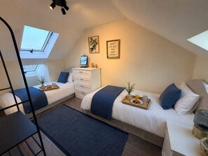 4 bedrooms, desk, iron/ironing board, travel crib