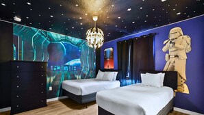 A hotel room with two beds, a Star Wars-themed wall, a large digital screen, and a ceiling with star patterns. - Upstay Lake View Villa with Hot Tub, Pool & Resort (Kissimmee)