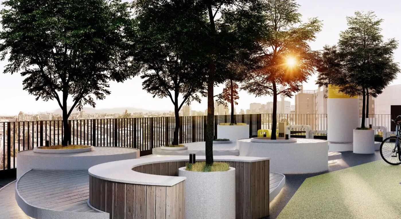 A rooftop garden with trees, seating areas, and a bicycle.