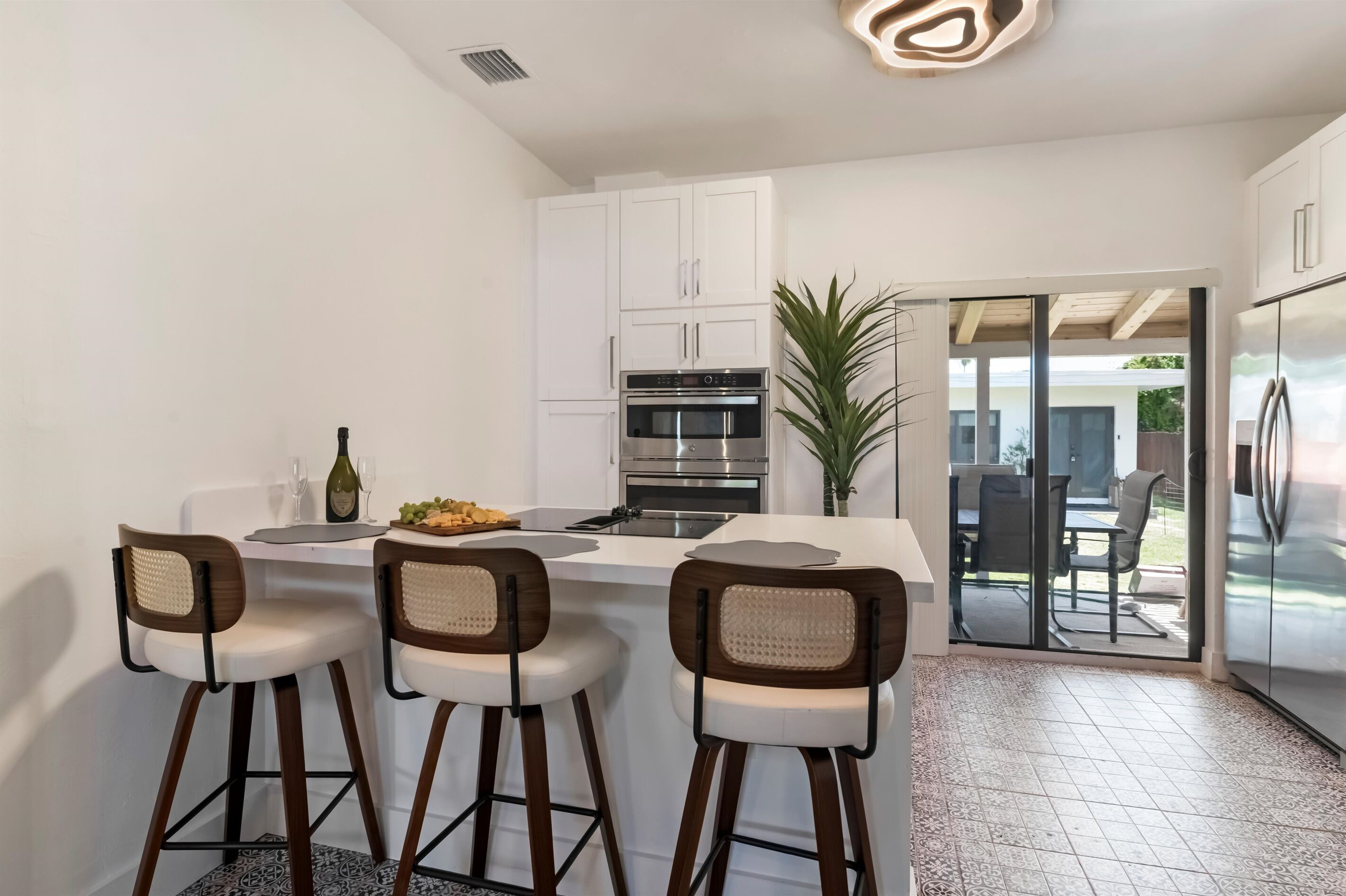 Kitchen: Sleek design with modern appliances and inviting breakfast bar for dining bliss!