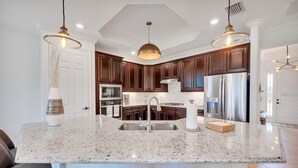 Fridge, microwave, oven, stovetop - Luxury 3BR Home on the 9th fairway in Lakewood National (Bradenton)