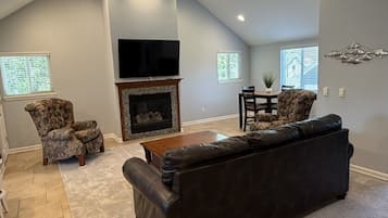 TV, fireplace, books