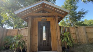 A wooden structure with a door, a sign above the door, and a small window. - NICEVILLE FLORIDA
Hammock Haven – Spacious, Serene & Just Minutes from the Beach (Niceville)