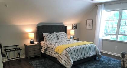 Large Suite over the Garage Apartment in the woods, yet close to town.