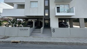 A modern multi-story residential building with a flat facade, balconies, and a ground entrance. - 1 Bedroom flat in Aglatzia (Aglantzia)