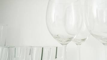 A row of clear glassware on a white surface.