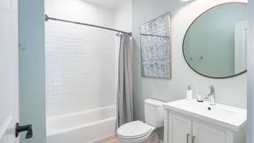 Shower, hair dryer, towels, shampoo