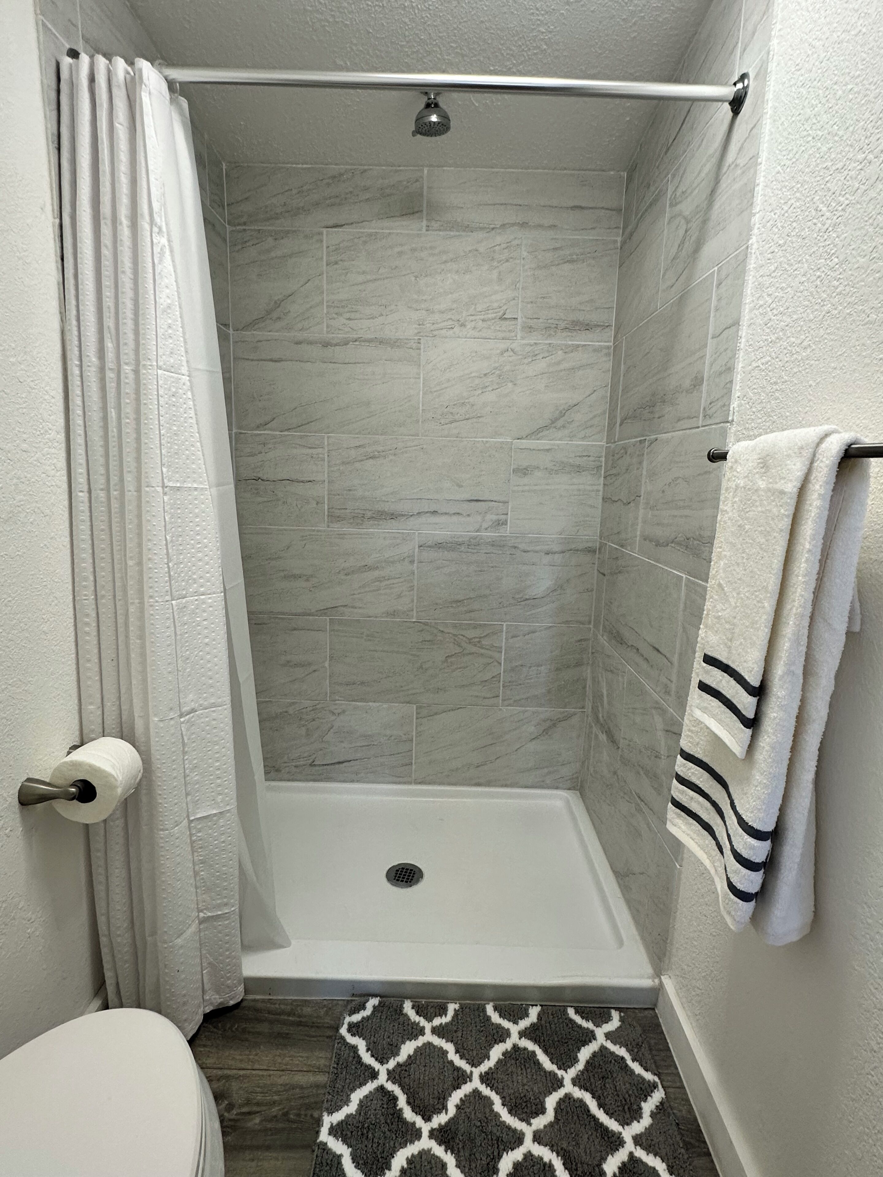 Shower, towels, soap, toilet paper