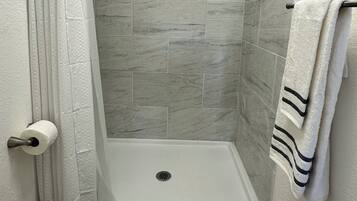 Shower, towels, soap, toilet paper