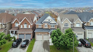 A residential area with multiple houses, each with a garage and a driveway.