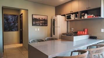 Deluxe Apartment, Pool View | Private kitchen | Mini-fridge, microwave, cookware/dishes/utensils