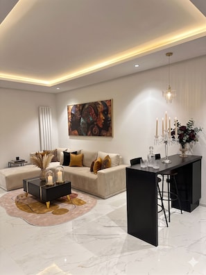 Căn hộ Deluxe, quang cảnh sân vườn | Khu phòng khách
