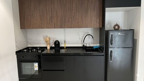 Căn hộ Deluxe, quang cảnh sân vườn | Bếp riêng | Tủ lạnh, lò vi sóng, lò nướng, bếp nấu 
