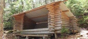 Log cabin style lean-to, perfect for nature lovers!