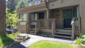 A two-story building with a front porch, a small staircase, and a mailbox. - Tahoe Pines Escape (Incline Village)
