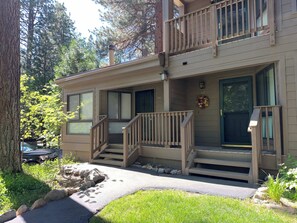 A two-story building with a front porch, a small staircase, and a mailbox. - Tahoe Pines Hideaway (Incline Village)