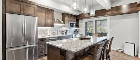 Modern fully equipped kitchen with a large island and breakfast bar