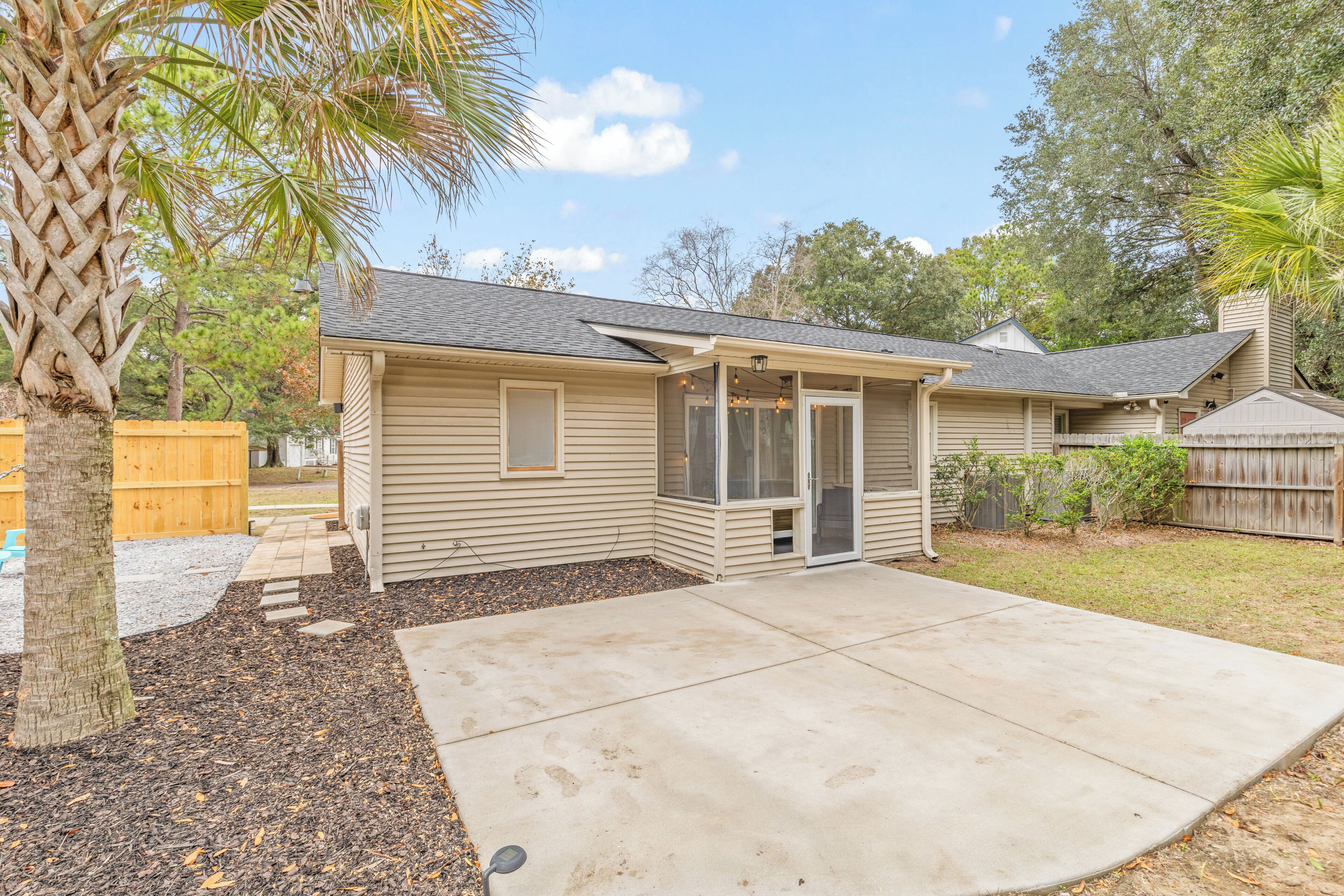 A single-story house with a covered patio, a small front porch, and a garage.