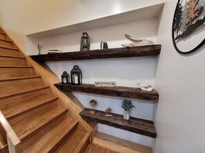 A wooden staircase with a sign reading 'Great Sacandaga Lake' on the landing. - Island View Escape: Lake, Private Beach, Deck, Firepit, Family, Game Room, more! (Broadalbin)