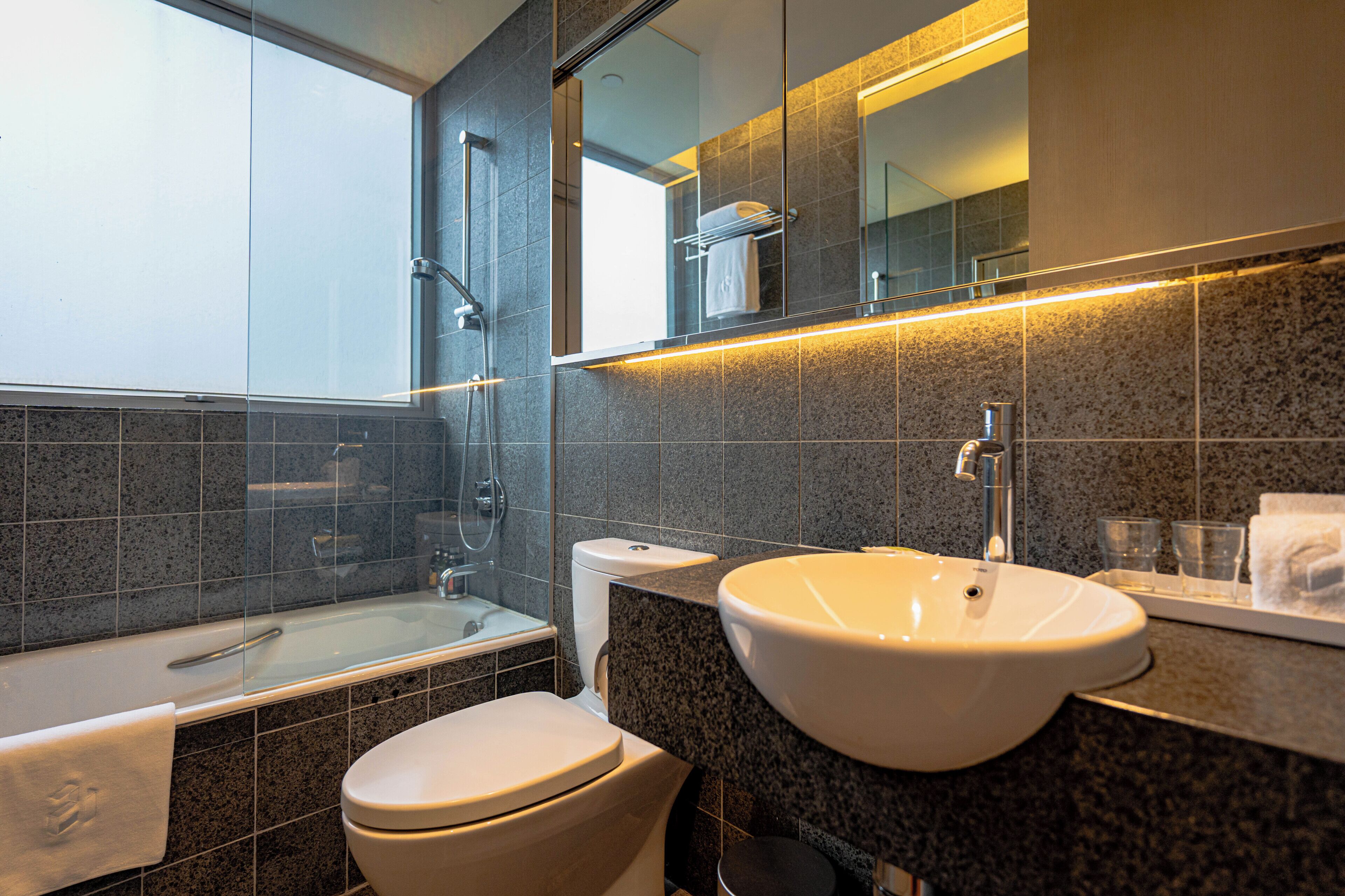 Shower, hair dryer, slippers, towels