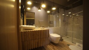 A modern bathroom with a large vessel sink, a toilet, and a glass-enclosed shower. - Rio Moment S (Castelo de Paiva)