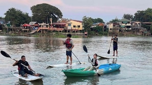 A calm water body with people kayaking. - Ayutthaya Rive Camp And Yacht Charter (Ayutthaya)