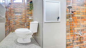 A bathroom with a toilet, a shower area with a hose, and a window. - Collection O Solo Near Univ Muhammadiyah Surakarta (Surakarta)