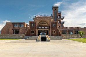 A building with a prominent entrance, a tower, and the name 'The Wine Station' above the entrance. - The Wine Station Hotel Tsinandali (Telavi)