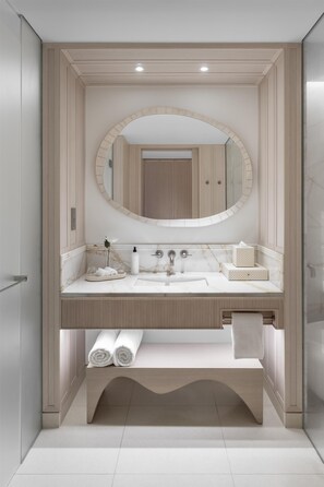 A modern bathroom with a vanity, sink, mirror, and towel rack. - Grand Hyatt The Red Sea (Shura Island)