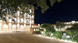 A large, well-lit building with arched windows and a spacious courtyard.